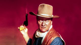 Cole Thornton (John Wayne) mit Revolver im Film "El Dorado" (Bild: Courtesy Everett Collection / picture alliance)