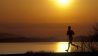 Jogger rennt zum Sonnenuntergang auf Vancouver Island, Canada (Quelle: imago/All Canada Photos)