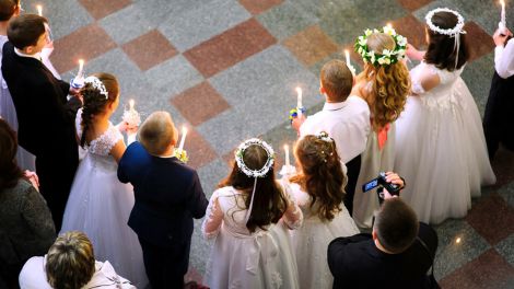 First holy communion in church, many children