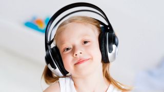 Pretty girl listening to music on headphones